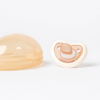 Creamy white Bebina Happy Face pacifier with a smiling face design for babies, made of soft, safe materials.