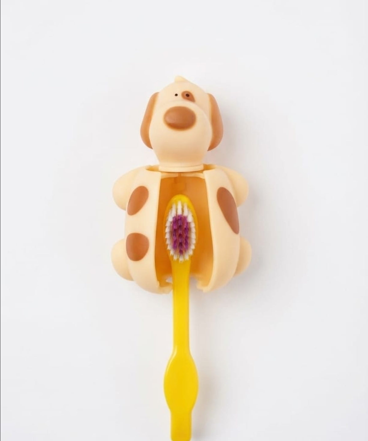 Miradent funny animal-shaped toothbrush holder holding a toothbrush, designed for bathroom organization and fun decor.